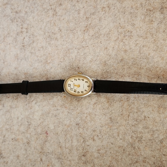 Watch by Sharp womens thin band battery watch. Delicate oval face and 14\